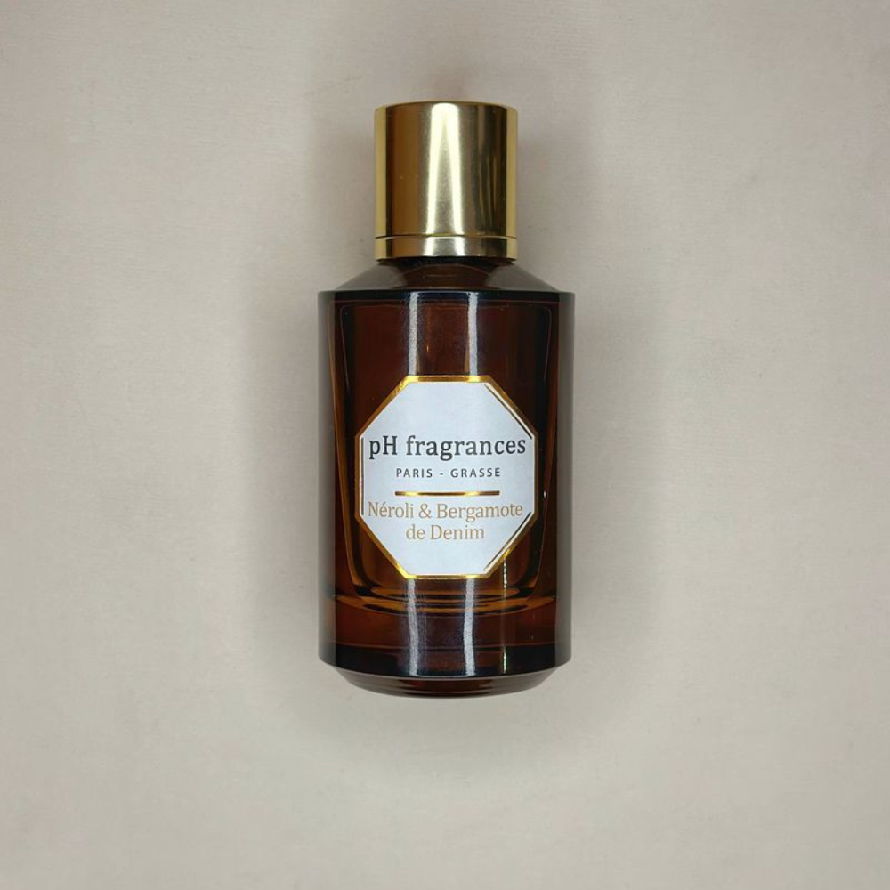 Au centre le flacon en 100ml de Néroli é Bergamote de Denim de la marque pH Fragrances disponible en 100ml et 50ml chez ICI Concept Store